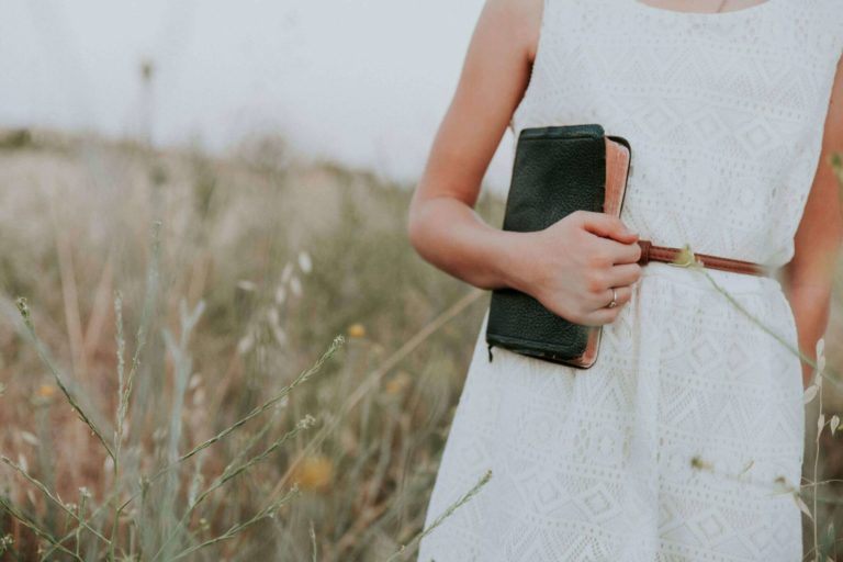 Girl Holding Bible